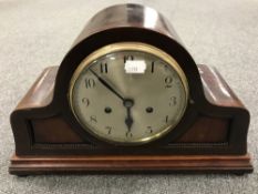 An early twentieth century mahogany mantel clock with silvered dial