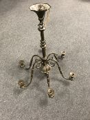 A heavy brass six way light fitting