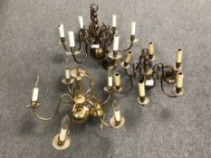 Three brass six way light fittings
