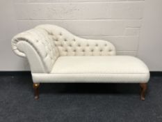 A contemporary button back chaise longue
