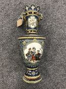 A Mettlach vase decorated with panels of children dancing, lattice decoration on blue ground,