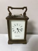 A brass cased Mappin and Webb Ltd mantel clock with key