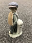 A Lladro figure - number 5400 boy wit nap sack