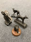 Three cast metal figures of greyhounds