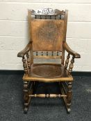 An Edwardian mahogany rocking chair