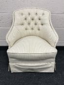 A contemporary button back bedroom chair