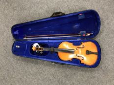 A violin and bow in carry case CONDITION REPORT: Labelled to interior 'The Stentor
