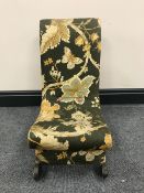 An early 20th century miniature child's bedroom chair