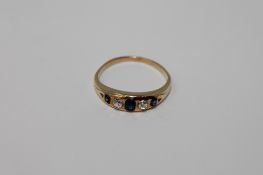 An 18ct gold diamond and sapphire ring, size L, 2.5g.