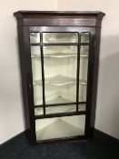 A Victorian mahogany glazed door hanging corner cupboard