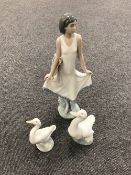 A Nao figure - girl in dress and a Nao swan
