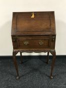 A mahogany ladies bureau on cabriole legs