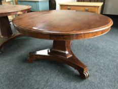 A circular Victorian mahogany breakfast table