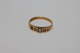 An 18ct gold pearl and diamond ring, size P, 2.3g.