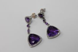 A pair of 9ct white gold amethyst earrings set with diamonds.
