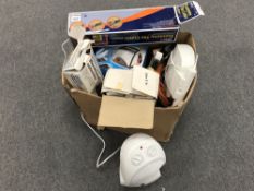 A box of tile cutters, electric heaters, extension lead,