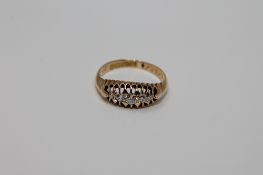 An 18ct gold five stone diamond ring, size J, 2.6g.