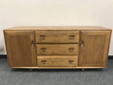 An Ercol light elm low sideboard, width 155.