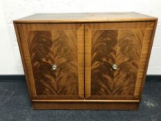 An inlaid mahogany double door audio cabinet,