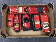 A box containing seven die cast Burago large scale die cast vehicles