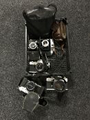 A basket of assorted cameras including Pratika TL3,
