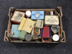 A box containing a quantity of vintage tins