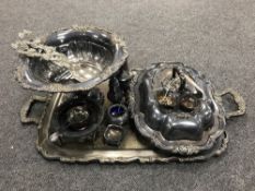 A plated twin handled tray containing twentieth century plated ware,