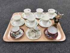 A tray containing six Royal Doulton Picardy china cups and saucers, a Goebel figure, 'Tooth Ache',