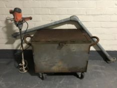 A metal storage chest on wheels,