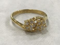 An 18ct gold double cluster ring