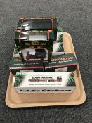 A tray of eight boxed Eddie Stobart die cast vehicles by Corgi and Atlas,