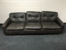 A late 20th century Danish brown leather three seater settee