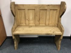 A reclaimed pine pew,
