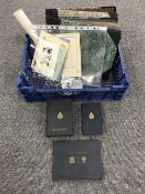 A box containing a collection of war time memorabilia and ephemera,