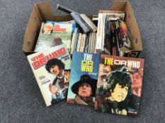 A box of paperback books and annuals relating to Dr Who and Star Trek