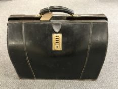 A leather Gladstone bag