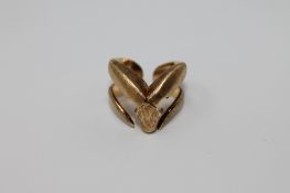 An 18ct gold ring by Ilias Lalaounis, modelled as a ram's head with swept horns, signed, 8.