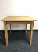 A contemporary oak dining table