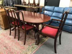 A contemporary inlaid mahogany dining table together with a set of five Queen Anne dining chairs,