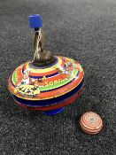 A mid 20th century Chad Valley tin plate spinning top and a tin plate yo-yo