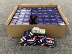 A box containing approximately fifty boxed Corgi die cast miniature vehicles