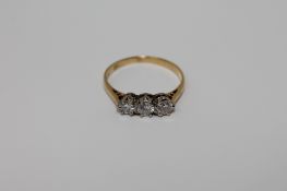 An 18ct gold three stone diamond ring, approximately 0.5ct, size O/P, 2.7g.