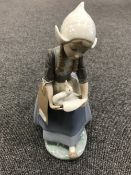 A Lladro figure - girl carrying a goose