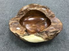 A rustic wooden fruit bowl