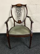 A Victorian inlaid mahogany armchair