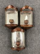 A box containing three cinema wall lights