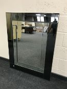 A sectional all glass two tone mirror