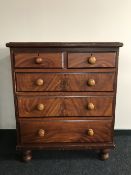 An antique pine five drawer chest