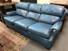 A Pemoragon blue leather three seater settee