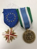 A UN medal with ribbon together with a medal for Europe with ribbon